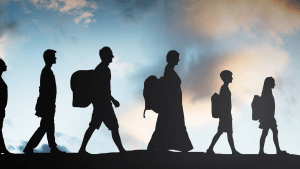 Silhouettes of refugees walking